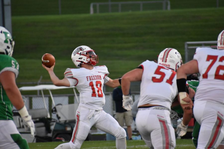 Senior quarterback Cole Beck prepares to throw the ball and get the offense rolling
against Riverside on Sept. 18.