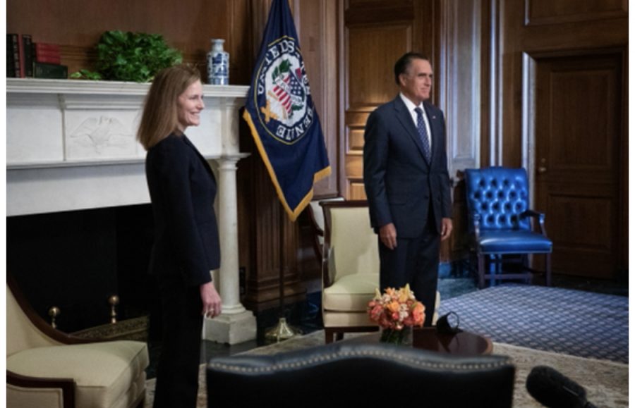 Utah Sen. Mitt Romney (R), right, is expected to vote to confirm Judge Amy Coney
Barrett, left, to the Supreme Court.