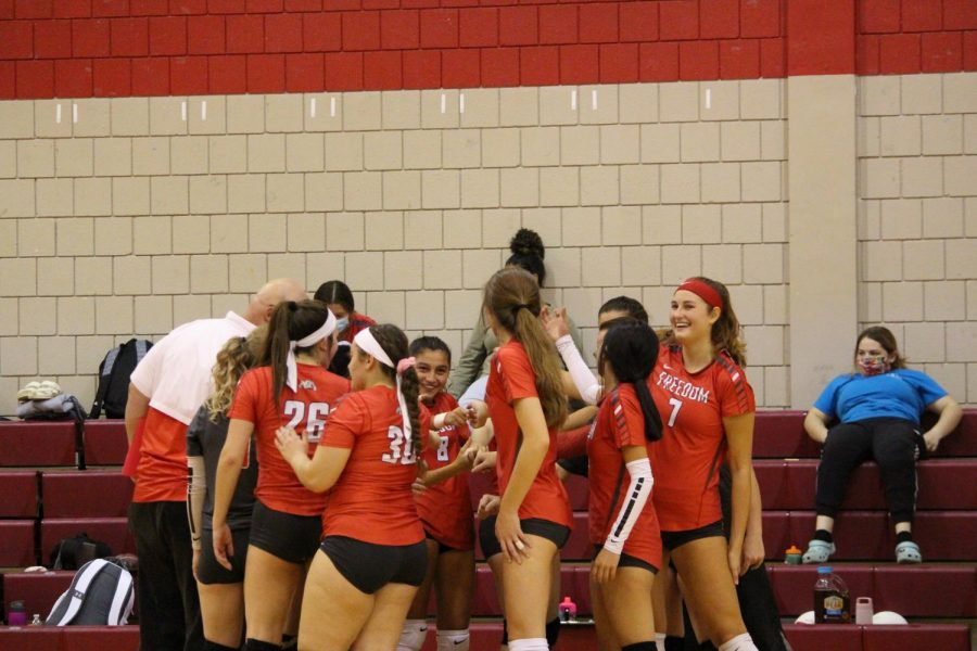 Volleyball team celebrates after starting off their game against Laurel strong on Oct. 8. 