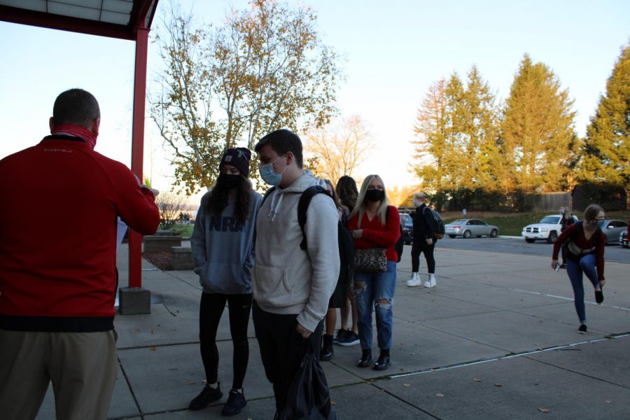 After eight months of virtual instruction due to the COVID-19 pandemic, students arrive at the high school for the first day of in-person classes on Nov. 9 for the first time since March 12.