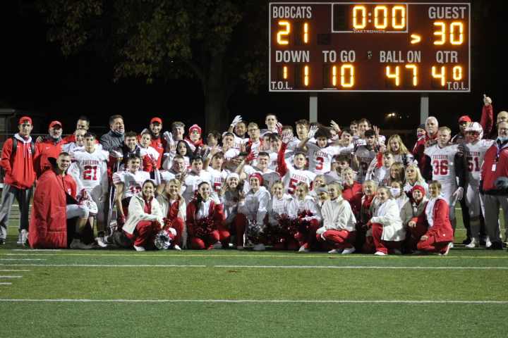 The+Freedom+football+team%2C+coaches+and+cheerleaders+pose+for+one+more+team+photo+after+their+30-21+win+against+the+Beaver+Bobcats+on+Oct.+30.