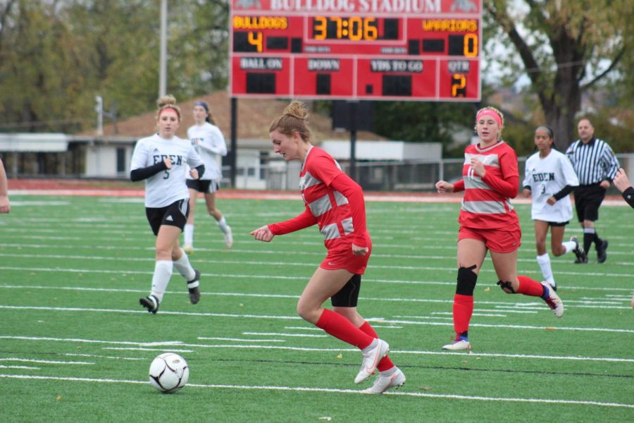 After a pass from Renae Mohrbacher, freshman Shaye Bailey looks to cut toward the goal in an attempt to score against Eden Christian Academy on Oct. 24. 