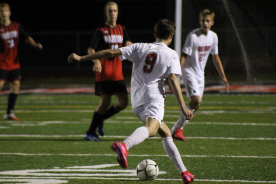 Sophomore Colin Fricke shoots the ball in an attempt to score against the Elizabeth Forward Warriors on Oct. 26. 