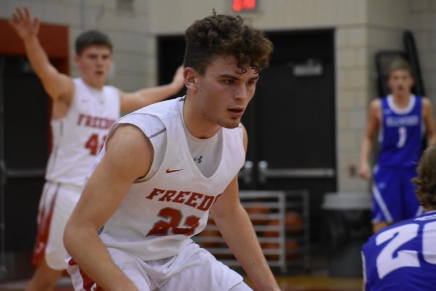 While on defense, then-junior Cole Beck focuses on his opponent at Freedom’s first home game of last season against the Ellwood City Wolverines on Dec. 9.