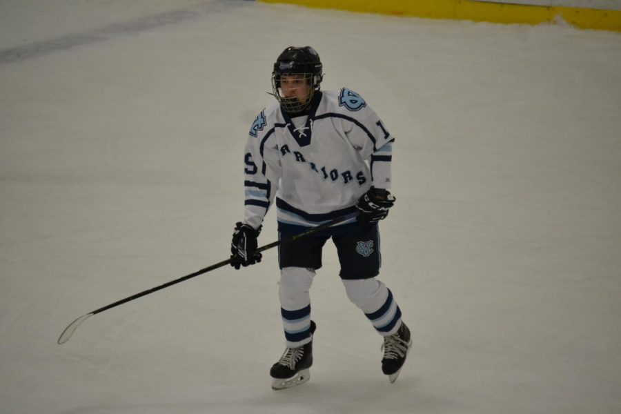 Trying to get the puck, senior Matthew Keller skates down the ice against Bishop Canevin on Nov. 11.