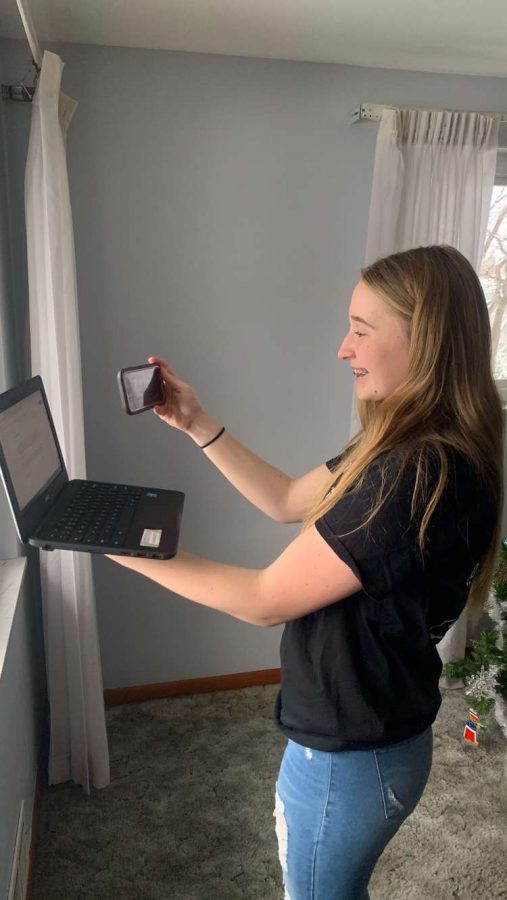 Senior Erica Gazdik prepares for her upcoming Broadcast Media Workshop video by recording herself reading her video's script.