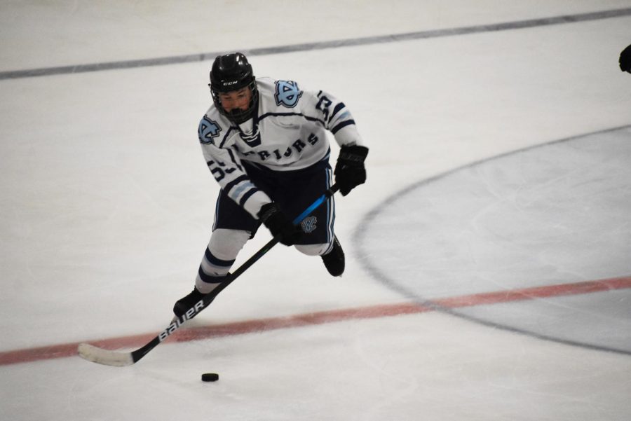 Freshman Chase Grable moves the puck up the ice for an opportunity to score for the Central Valley Warriors on Dec. 10.