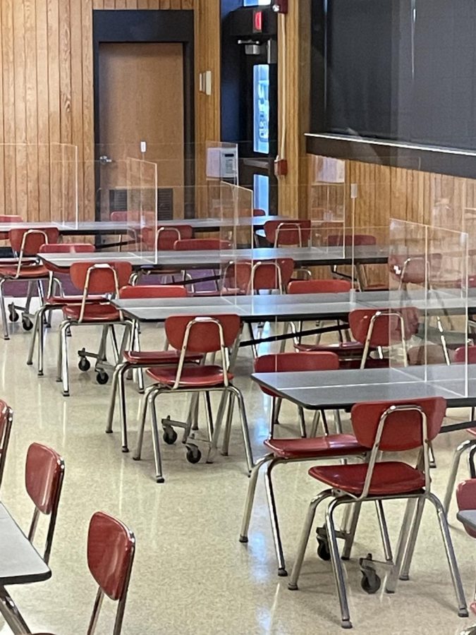 District leaves up plexiglass in cafeteria for kids to continue to eat safely on hybrid model. 