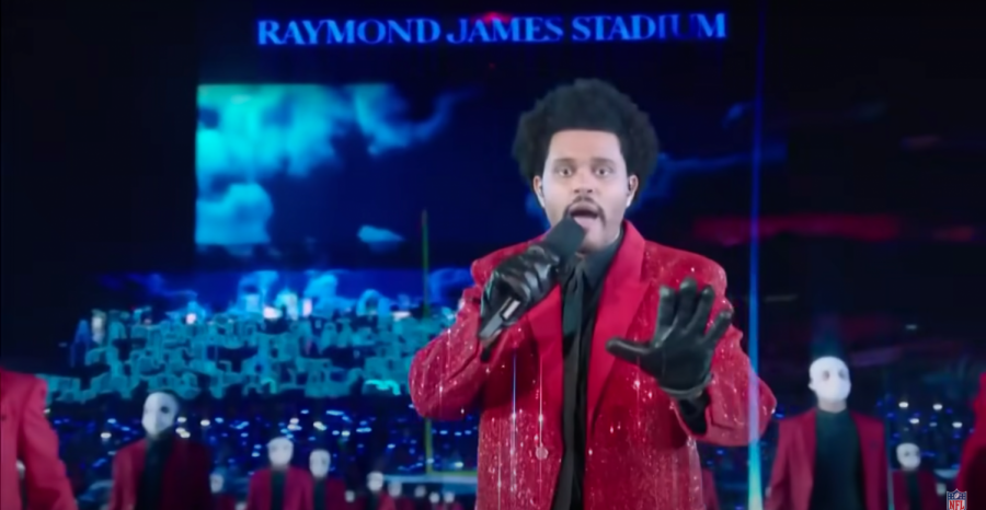 The Weeknd, surrounded by backup dancers, performed "Blinding Lights" from the field of Raymond James Stadium during his halftime performance.