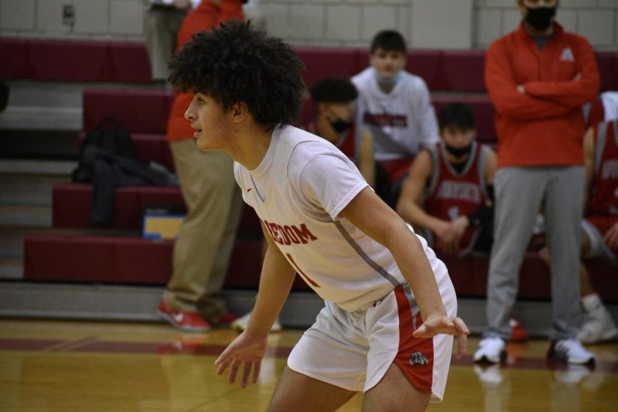 Senior Tyrique Campbell readies himself on defense while eyeing up an approaching opponent on Feb. 9 against Avonworth.