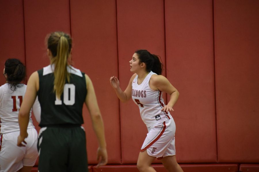 Junior Olivia Evans follows a shot to the boards, looking for a rebound on Feb. 4 against Laurel.