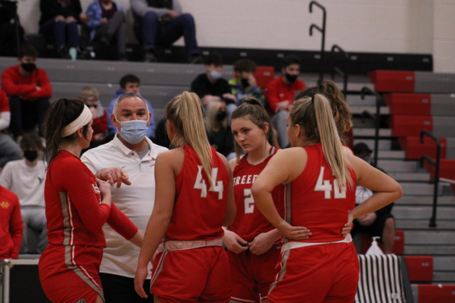 Head Coach John Kaercher gives the Bulldog starting lineup a pep talk just before the March 6 tipoff against North Catholic for the
WPIAL quarterfinals game.