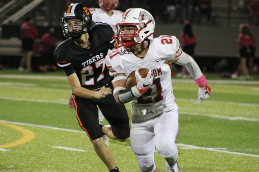 Making a move and avoiding a Beaver Falls defender, junior running back Joshua Pail runs the football on Oct. 15 at Geneva’s stadium.