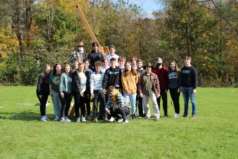 On Nov. 5, the members of Physics Club and Dr. Brian Wargo gathered around the
trebuchet after a successful day of launching various items across the field.