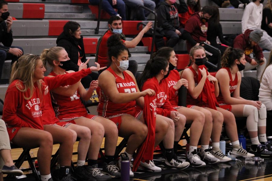 Last year’s team sits on the bench at their WIPAL game at North Catholic on March 6, 2021. 