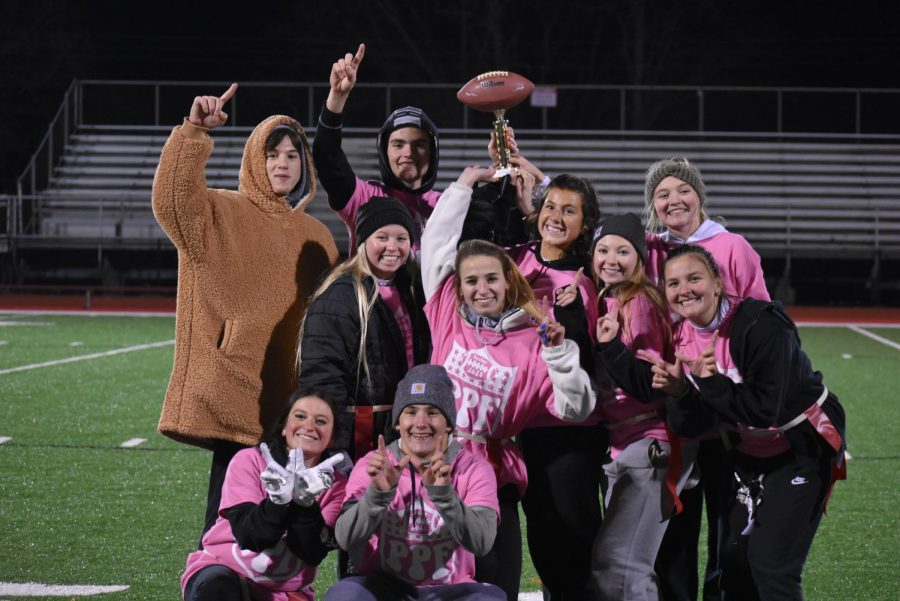 The senior team poses for a team photo with their trophy after winning the championship game on Nov. 22.