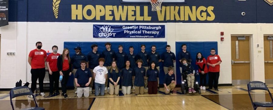 After a hard-fought victory, the Freedom bocce team shows their sportsmanship as they take a group photo with the Vikings team.
