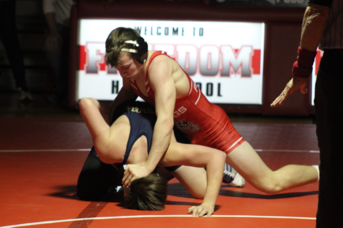 Sophomore Cody Patterson holds his ground with his opponent from Hopewell on Feb. 8.