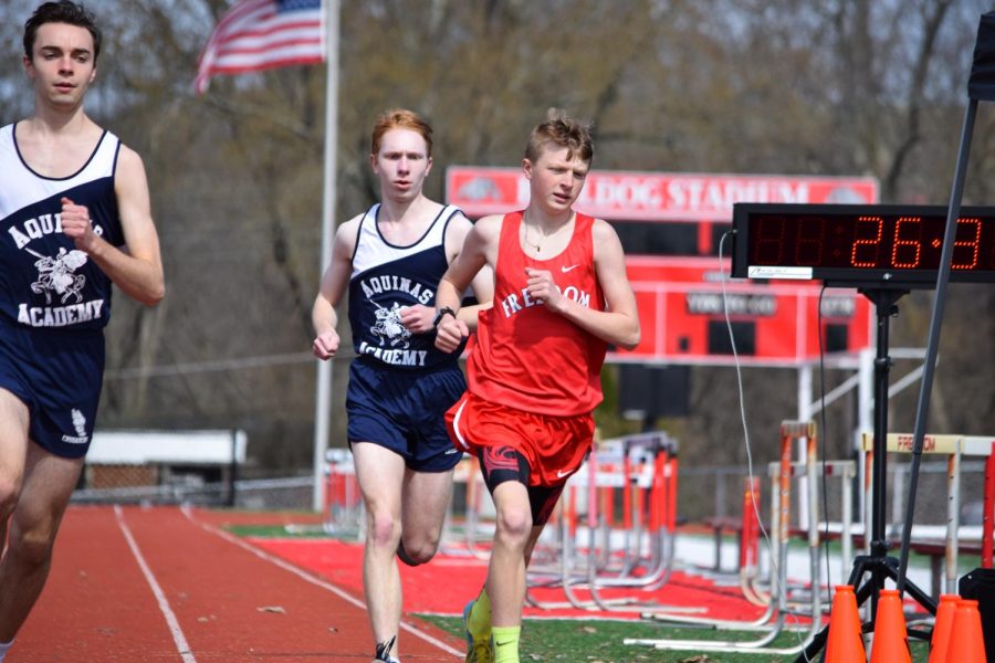 Then-freshman James Couch races against Aquinas Academy athletes during a home meet last season against both Aquinas Academy and Beaver Falls on March 26, 2021.