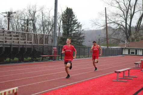 Freshman Jordan Delon [left] and sophomore Jaden Winterhalter [right] round the final stretch as they run the 800 meter. 