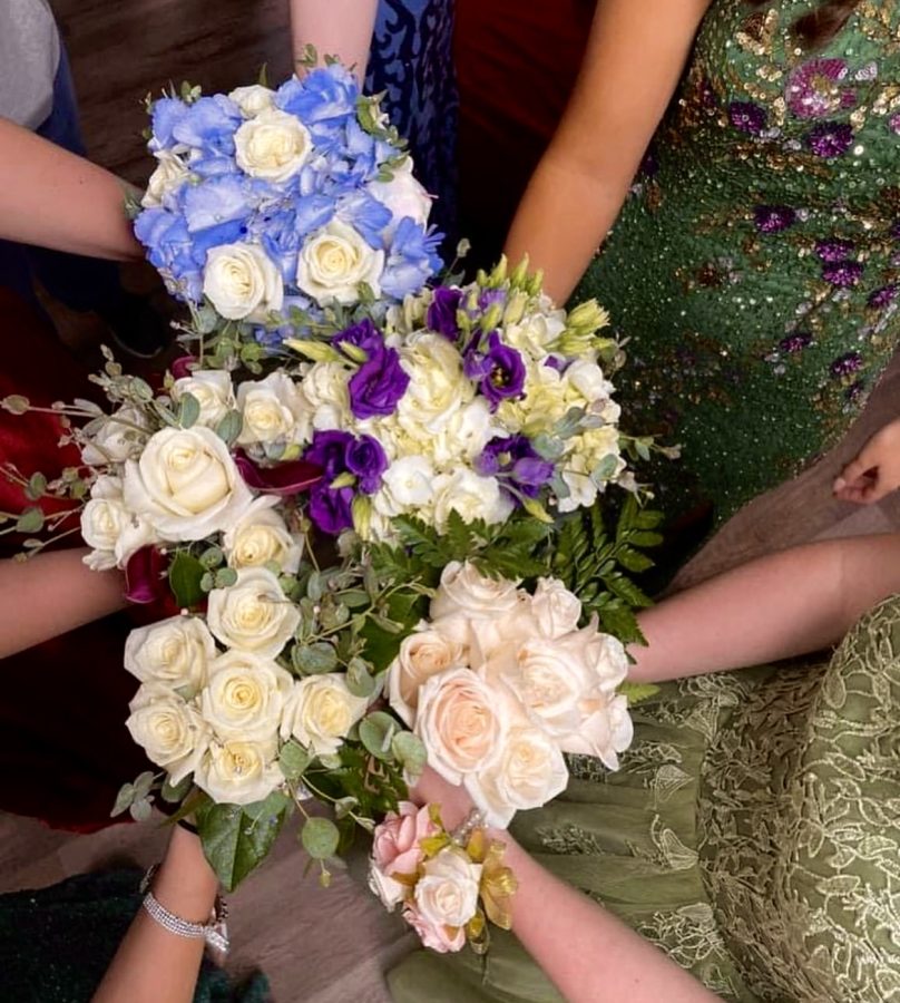 Students show off their prom flowers in a circle on May 6. 