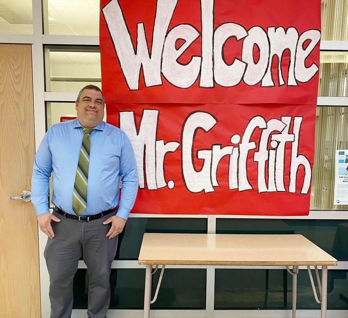 Mr.+Griffith%2C+now+middle+school+principal%2C+++is+welcomed+with+a+sign+from+the+students.