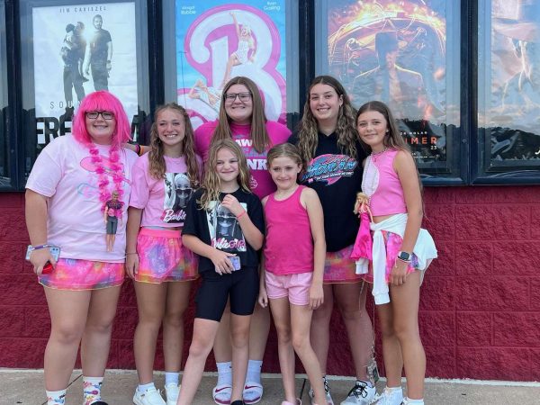 High School girls Alyssa Bearer, Trinity Vojtko, and Rylie Vojtko, dress up to go and watch the Barbie movie on July 23, with their sisters and younger friends. Fans across the country weredressing up in pink to go watch the hit movie intheaters.
