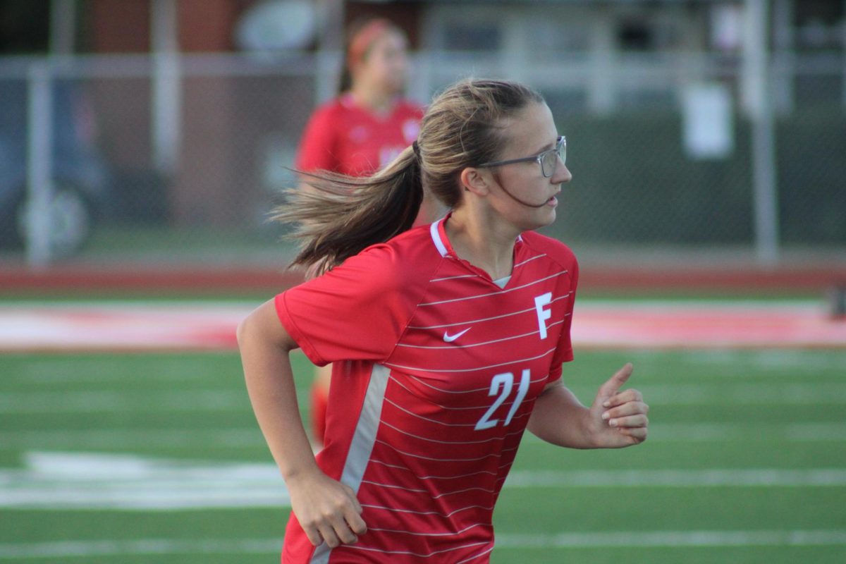 Looking Alive: Freshman Cheyenne Sharp runs to get into position as the ball is turned upfield during a home game against Montour on Sept. 14.
