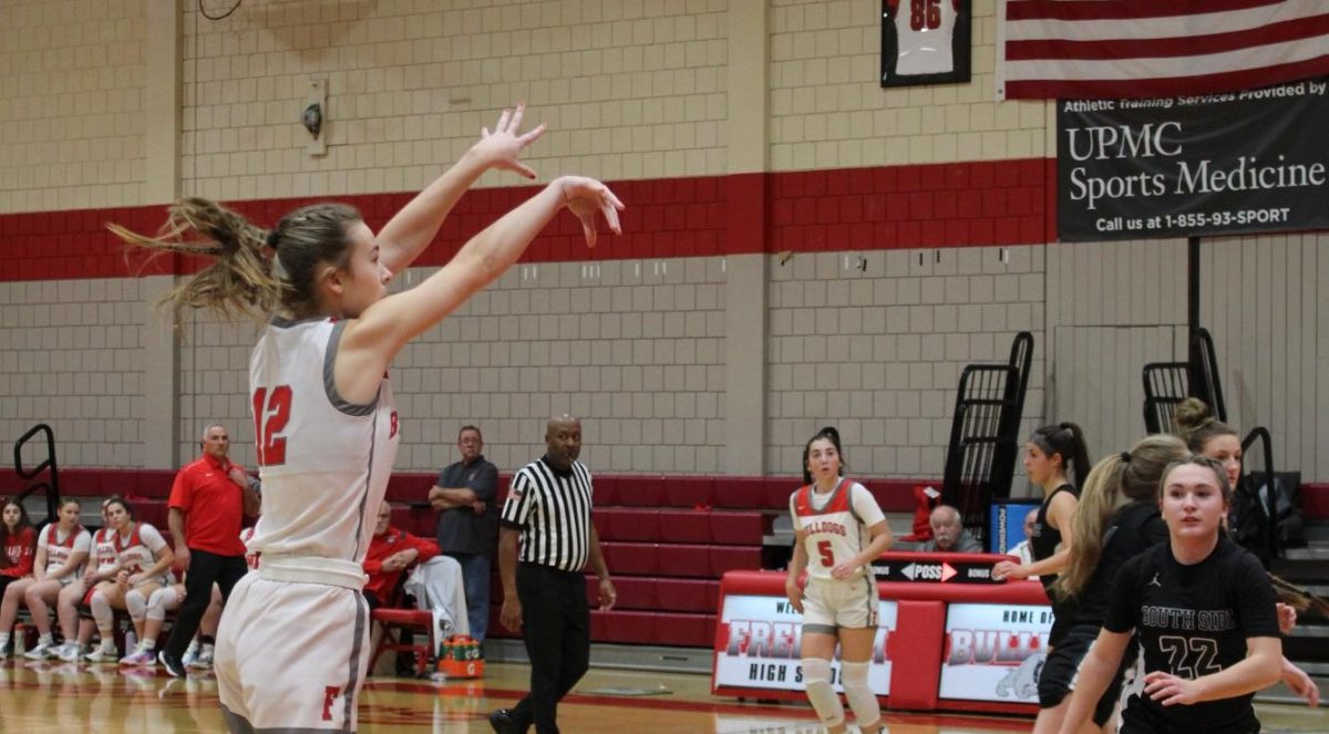 Wide open: With no pressure on her, sophomore McKenzie Morhbacher shoots a three-pointer on Dec. 14, when Freedom hosted South Side at the high school. The Bulldogs beat the Rams by a score of 55-43. 