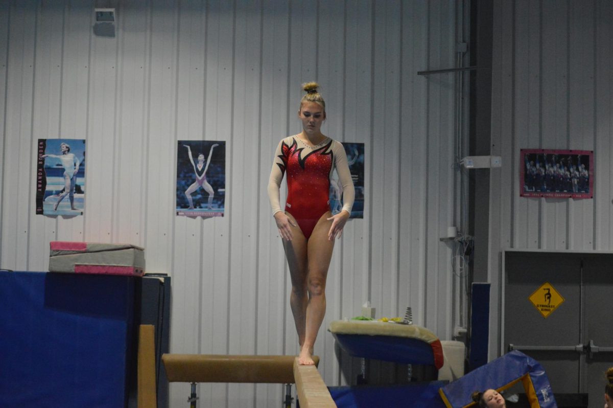 Top Technique: Posing, senior Daisy Lewis is competing in her beam routine on Jan. 5 at Monaca Turners. Lewis had one of the top scores on the beam. 