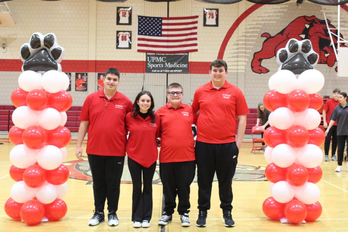 Last hurrah: Seniors Anthony Batagglia, Brenna McIlvain, Steffan Paganie and Wyatt Boyer pose to be recognized during their senior night game on Feb. 1. This was the bocce team’s very first senior night ceremony and celebration. 