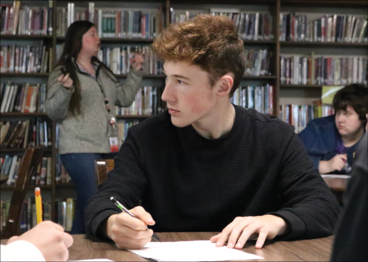 Future Focus: Sitting in his chair, senior Chase Grable takes notes. Sometimes Ms. Keith needs a bigger space to do interactive activities, so her class will use the library. 