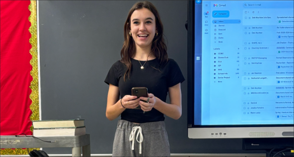 Perfect presidency: Giving her speech, senior Emma Falk updates the National Honor Society members on the current news about the school. As the president, Falk must put together an agenda for each meeting and keep everyone on task. 