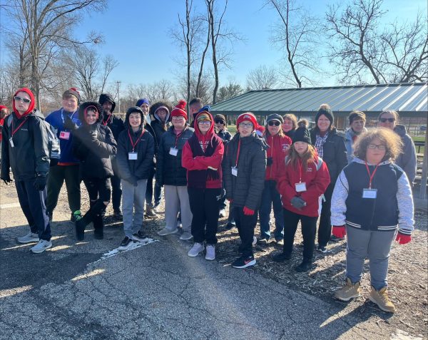 Prepared participants: Gathered in a group, Special Olympic students smile after attending the Special Olympics Preview Day at Moon Township Park on March 22. This day allowed students to try different sports, meet other students, and learn about the upcoming Special Olympics.