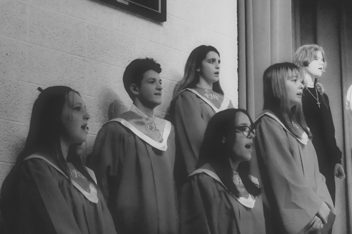 Perfect harmony: On December 4 in the middle school auditorium, choir students in grades 5-12 performed Christmas and winter songs to the community.