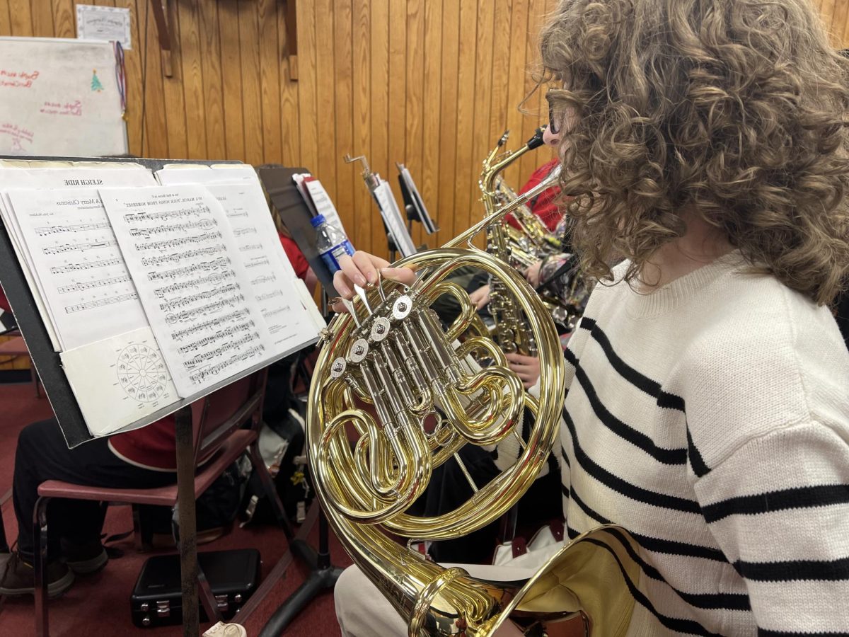 Getting up to treble: Playing diligently, Audrey Mooney (10) practices her audition piece in front of Julia Lawrence in preparation for the actual audition. Many students will do this, as it gives students a chance to see what it is like to perform in front of an adult.