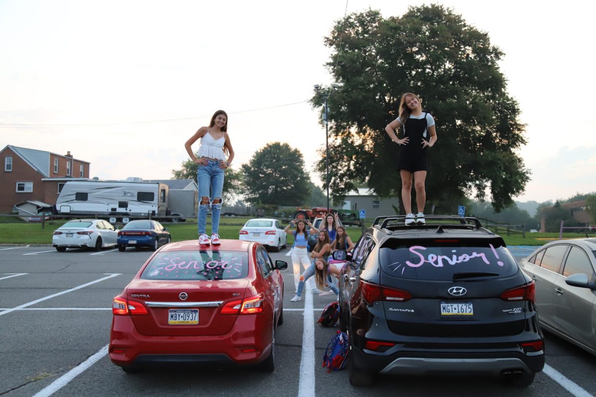 Admiring the view: Seniors arrived at school early on their first day to watch the sunrise as a way to kick off the school year. On May 2, senior students have the opportunity to watch the sunset as a remembrance of their high school careers.