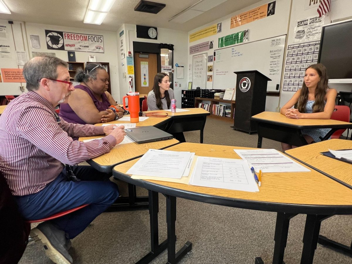 New and improved: Speaking proudly, Sara Aland (12) is interviewed by teachers for her senior project. This is the first year that students who passed their Keystone exams did interviews instead of presentations. 
