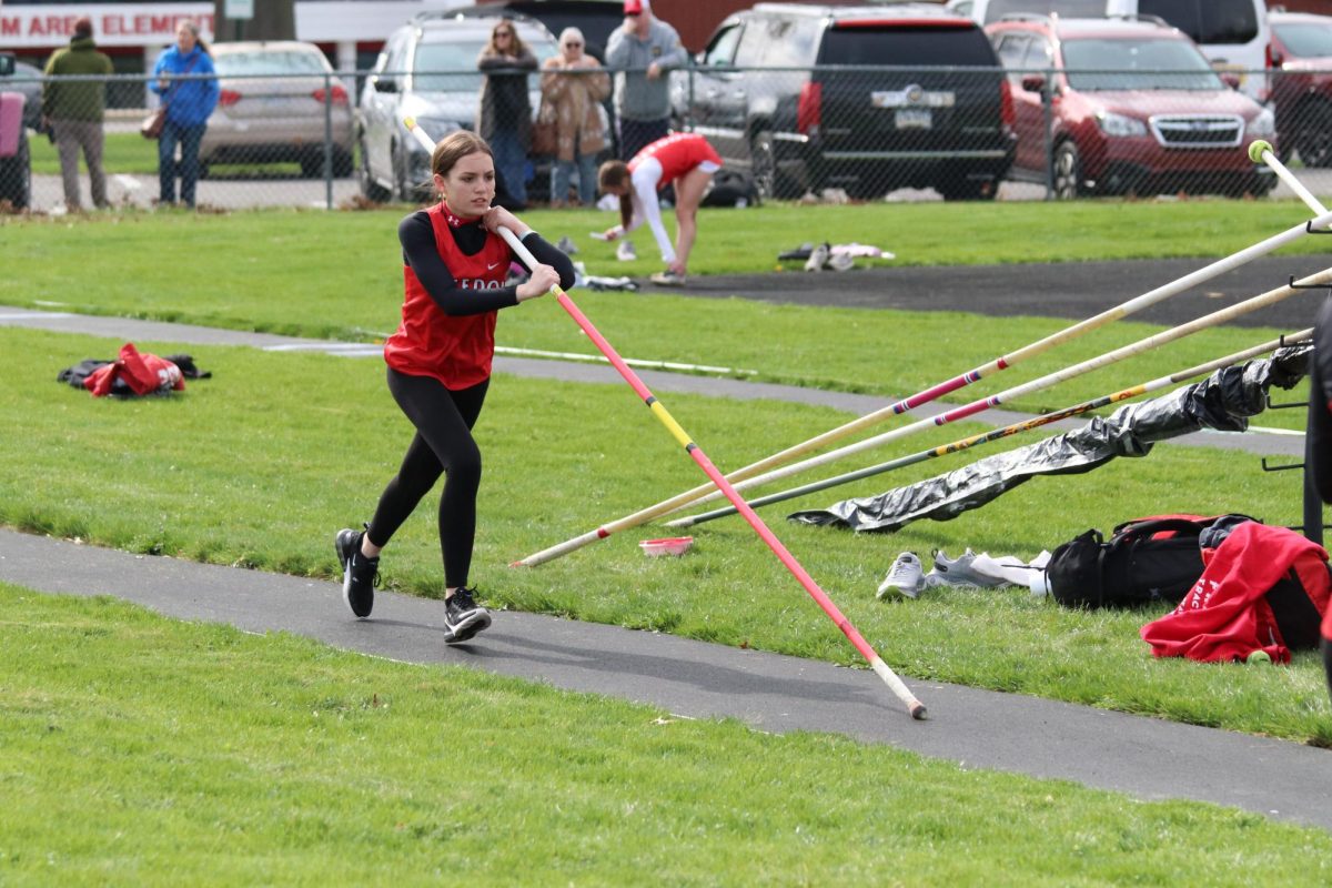 Stepping up: Beginning her stepping sequence, Kendall Climo (10) prepares to pole vault over her starting height. This was Klimos' first year doing pole vault, and her PR was 7’.