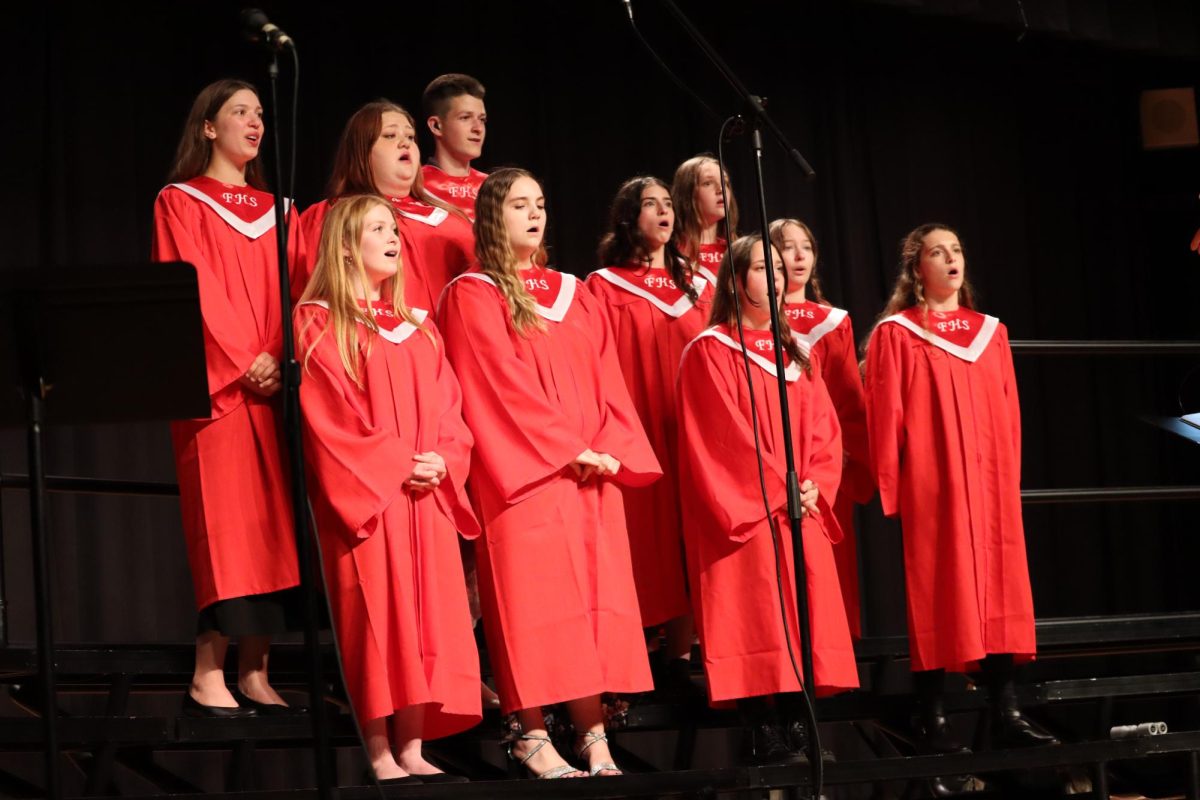 Spring is in the air: Standing on risers, the high school chorus performs its final concert of the year. The spring concert was a great way of showing how far the chorus has come and allowed the members to showcase their talents and hard work.