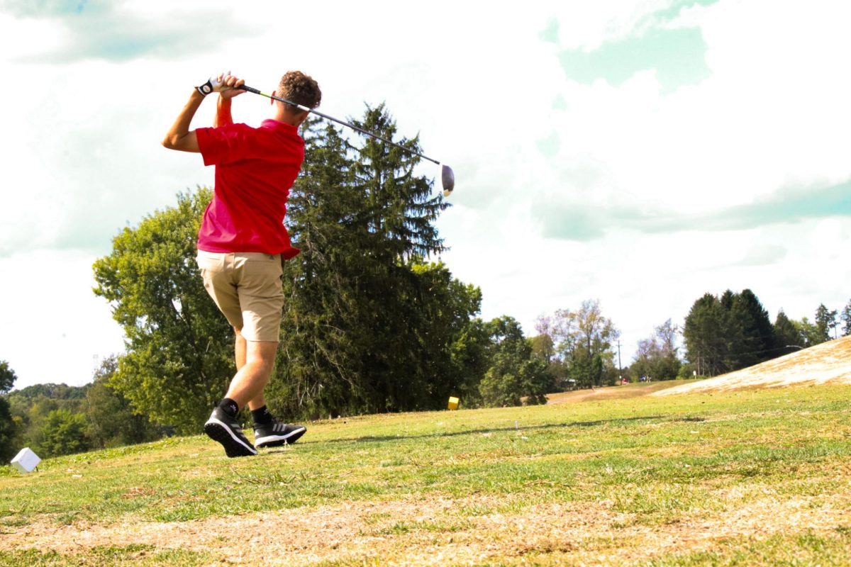 Tracking tees: Keeping his score in mind, Logan Meyer (10) watches the ball’s direction after his shot. Meyer’s contributions helped push Freedom to defeat Lincoln Park (235-248) in their match on Sept. 3. The Bulldogs also played Beaver Falls and Central Valley, but were defeated.